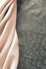 Smooth elegant beige and olive green satin texture can use as abstract background. Luxurious...