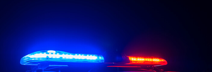 Red and blue lights of a police car at night close up. stock photo
