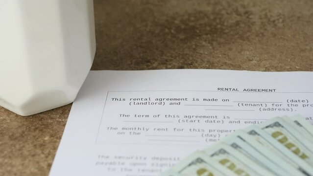 rental document and coins close-up