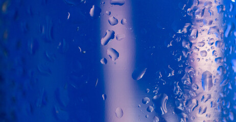 Light blue background with water drops and light reflections. Space for text. Abstract wallpaper
