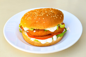 Big tasty burger with beef cutlet on a plate. Hamburger, cheeseburger with mushroom. Crispy chicken burger.