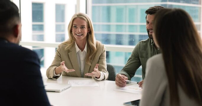 Pretty businesslady hold formal meeting with partners or colleagues, make speech, share insights and opinion, conduct negotiations met with shareholders in board room. Business, solutions, leadership
