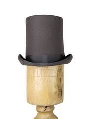 Magic hat. Topper. Elegant vintage gray beige wool felt top hat with black band on the wooden hat...