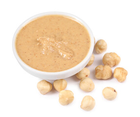 Delicious nut butter and hazelnuts isolated on white