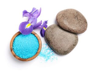 Fototapeta na wymiar Light blue sea salt in bowl, spa stones and iris flower isolated on white, top view