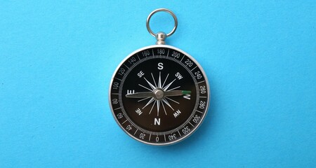 One compass on light blue background, top view © New Africa
