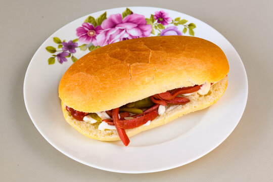 Close-up shot of Izmir's famous Turkish Traditional Kumru Sandwich, Ceşme Kumru, patso ingredients ready to eat salami, soudjouk, tomato, cheddar cheese and fried cheese. Yengen sandvic.