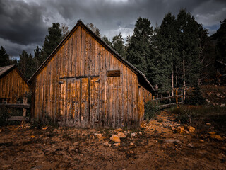 Weathered barn before a storm