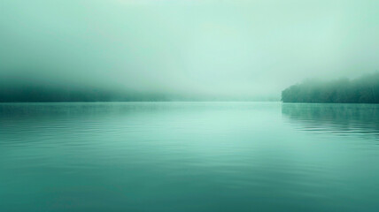 A serene blend of translucent ash gray and muted teal, forming a minimalist background that captures the tranquil essence of a misty lakeside morning