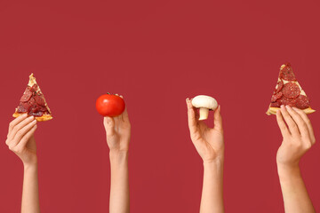 Many hands holding pizza slices, tomato and mushroom on red background