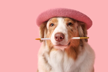 Cute dog in beret and with paint brush on pink background