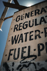 Old rusted sign along the highway
