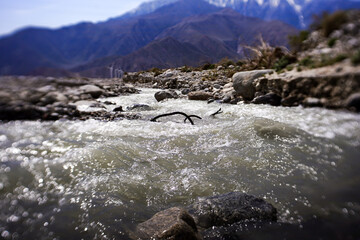 Rushing river at the base of the mountains