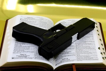 Handgun on a holy bible 