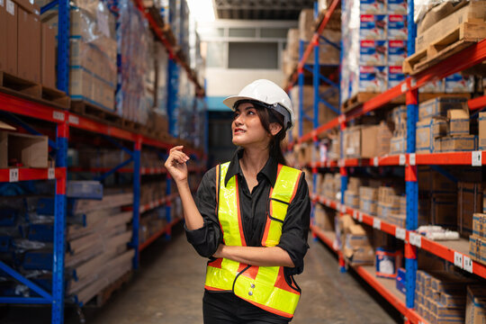 Women warehouse employee worker enjoy working in warehouse, Logistic industry concept.