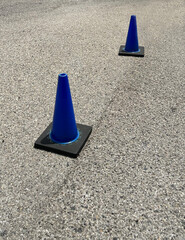 Blue traffic cones on a street