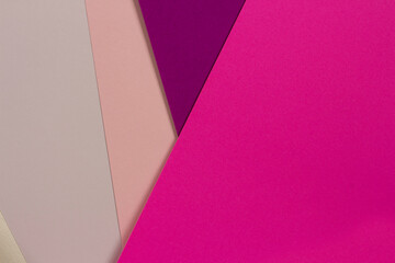 Colorful cardboard sheets layout in pink and purple shades