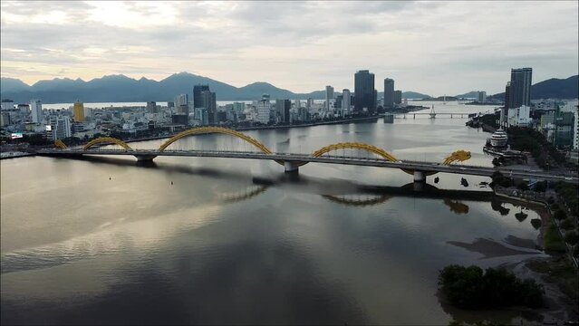 Aerial drone cinematic footage of the City of Danang in Central Vietnam, South East Asia. This city has many bridges including the Dragon Bridge which can be seen in this video