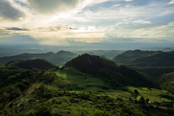 Beautiful sunlight and blue sky with cloud over the mountain of Thailand.