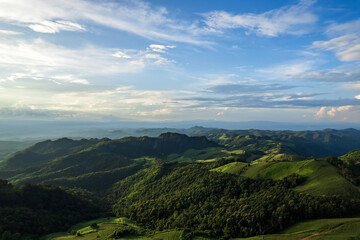 Beautiful sunlight and blue sky with cloud over the mountain of Thailand.