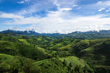 Beautiful sunlight and blue sky with cloud over the mountain of Thailand.