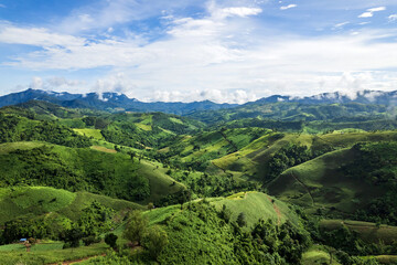 Beautiful sunlight and blue sky with cloud over the mountain of Thailand.