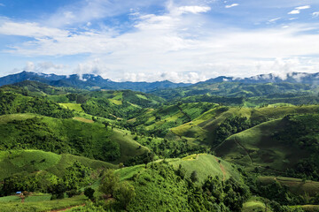 Beautiful sunlight and blue sky with cloud over the mountain of Thailand.