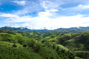 Beautiful sunlight and blue sky with cloud over the mountain of Thailand.