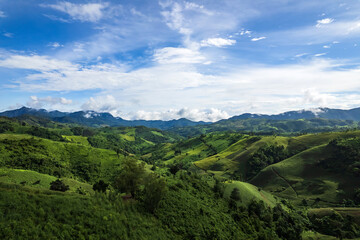 Beautiful sunlight and blue sky with cloud over the mountain of Thailand.