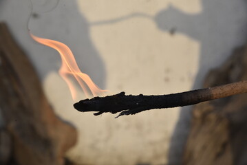 burning match on a fire