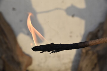 burning match on a fire