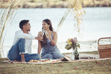 Man, woman and date with picnic, wine and romance for love or relationship anniversary. Couple,...
