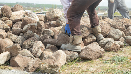 Craftsman working in rough stones in outdoor. - 790552216
