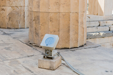 LED flood light mounted on stone flooring at an archaeological site, in Athens Greece