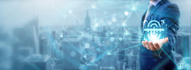 Businessman holding biometric icon, networking and data exchanges, secure connections, identity verification, authentication services, secure transactions, and reliable networks.