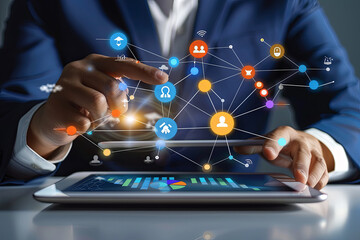 Digital online marketing concept, with businessman using tablet to analyze sales growth graphs and icons on global network connections

