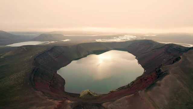 Aerial View of Iceland Ljotipollur Crater Water Filled Caldera at Sunset. Drone Circles Around Epic Wide Volcano Explosion Crater. 4K High Quality Color Corrected.