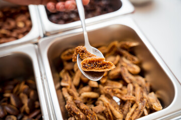 Young woman in the workshop during a lesson on making handmade chocolates and sweets