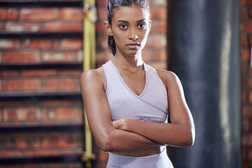Woman, portrait and fitness with confidence at gym for workout, training or indoor exercise....