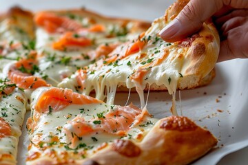 Delicious cheese pizza slice with salmon topping being pulled away