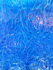 Blue ice as an abstract background. Texture