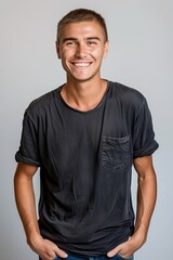 Fototapeta premium Portrait of a Young Man in Casual Attire hand in pocket, on white background.