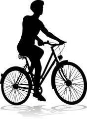 Bicyclist riding their bike and wearing a safety helmet in silhouette