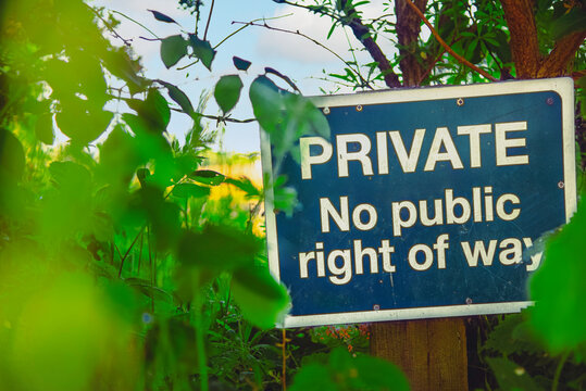 Private, no public right of way sign in the middle of nature. Concept of privatization, privacy and personal property, data or space. Right to walk freely. Countryside rights of way.