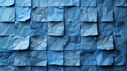   A tight shot of a blue wall adorned with halved sheets of paper, neatly stacked