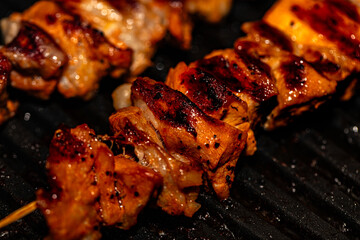 Closeup of meat prepared on electric grill - obrazy, fototapety, plakaty