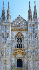 Spires of the Cathedral Duomo di Milano, dedicated to St. Mary of the Nativity. Imposing architectural details close-up. View, details, architectures and embellishments.