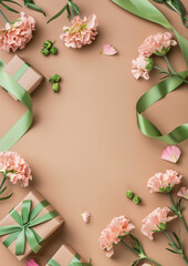 카네이션 꽃과 녹색 리본으로 장식된 선물 박스