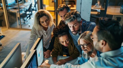 Enthusiastic Teamwork at Computer in Modern Workspace