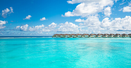 Maldives water villas paradise background. Tropical landscape, seascape with long pier, water...